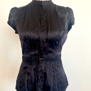 Women's button down blouse with cinched ruffled ribbon waste